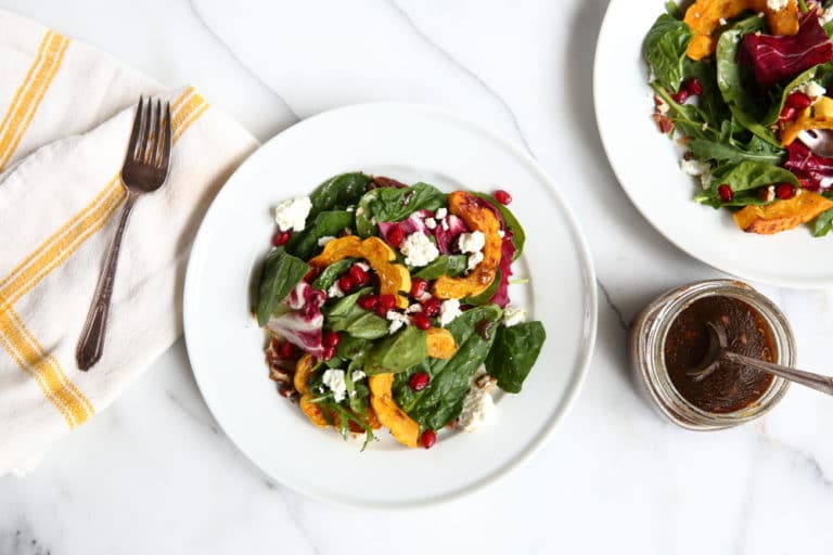 Roasted Squash Salad on plates with maple balsamic dressing