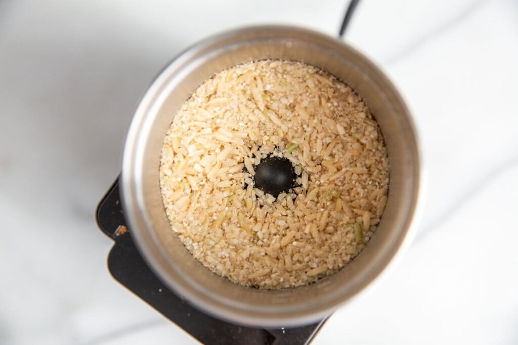 rice getting broken down in a spice grinder