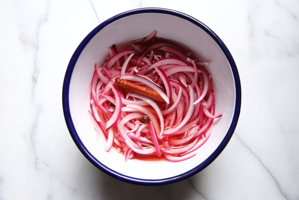 Pickled red onions in a bowl.