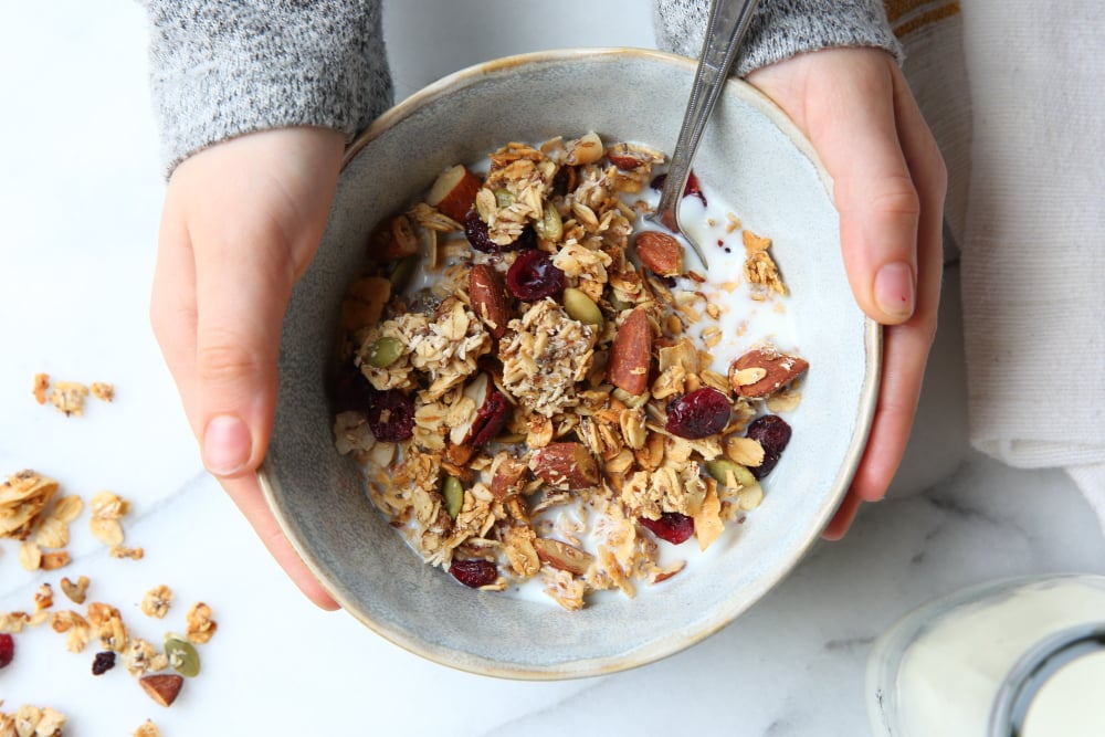 Gluten free granola recipe in bowl with milk