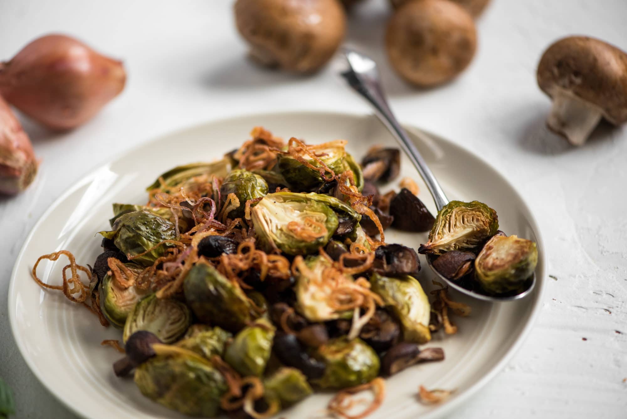 Caramelized Brussels sprouts with mushrooms and fried shallots