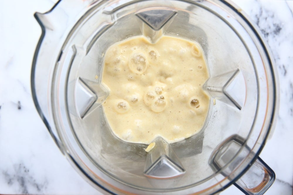 Process shot showing pureed bananas in the blender.