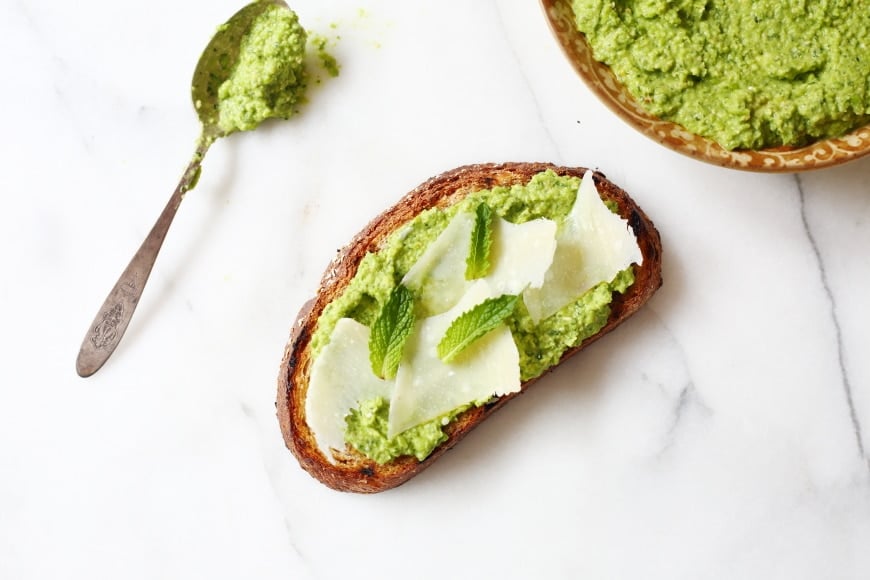 Pea pesto on crostini with shaved parmesan cheese.