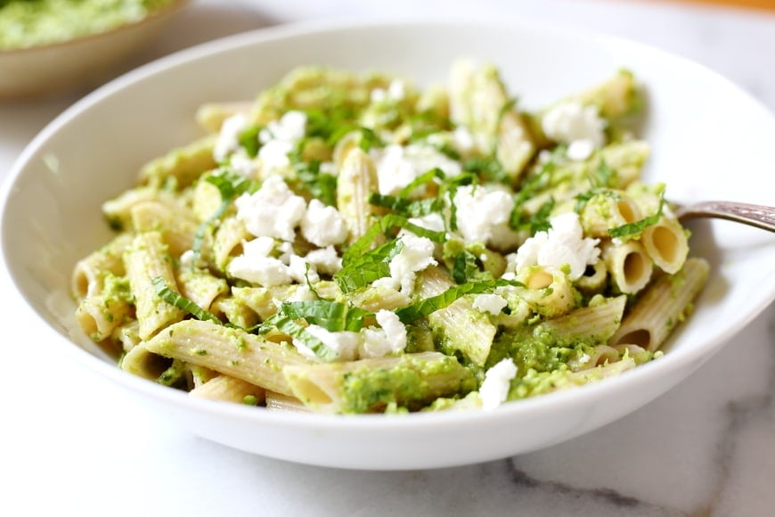 Pesto tossed with pasta, topped with goat cheese.