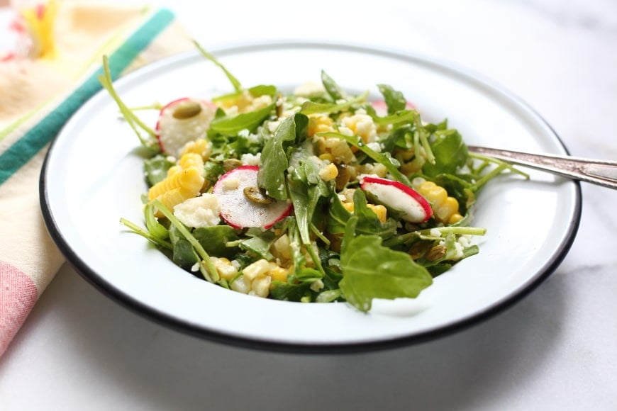 Close-up side view of corn salad.