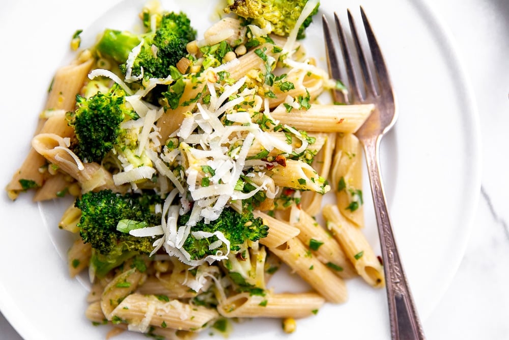 Broccoli pasta on plate with grated Pecorino cheese