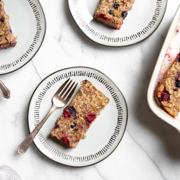 Overhead shot of baked oatmeal bars on plates with forks.
