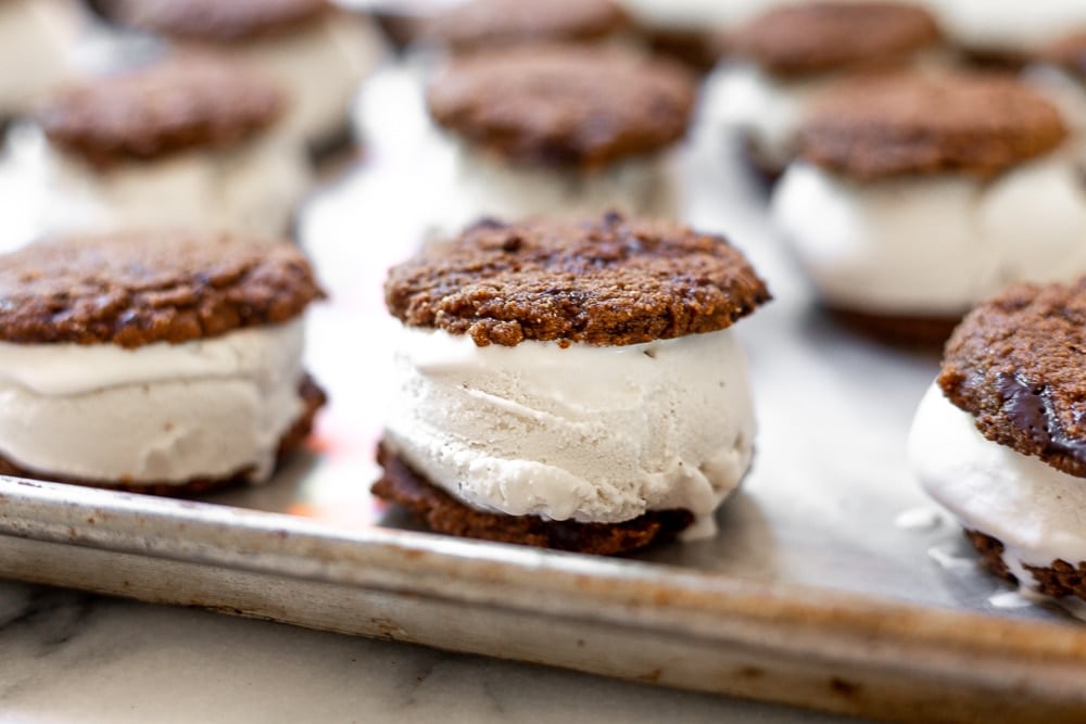 Vegan ice cream sandwiches lined up on sheet pan