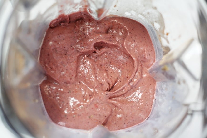 Overhead shot of the superfood berry smoothie bowl in the blender container