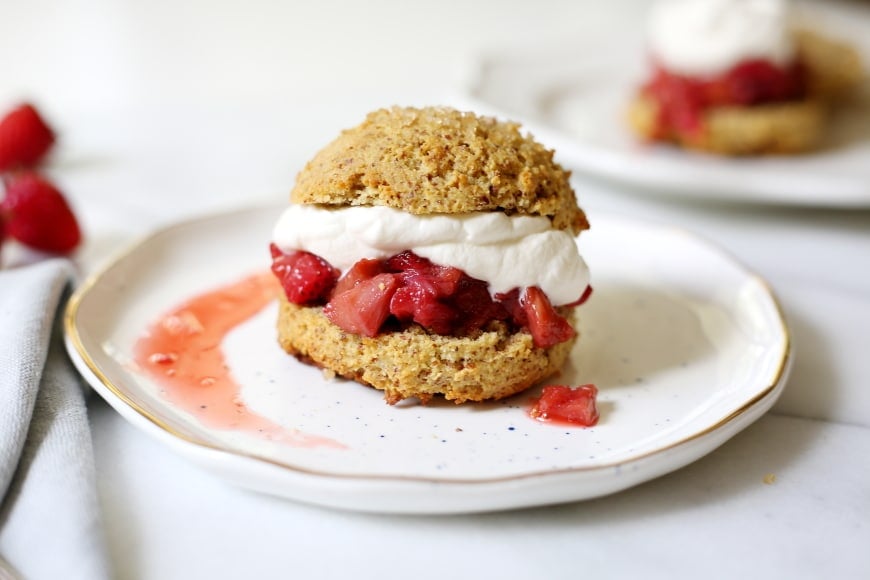 These lightly sweetened gluten free shortcakes are almond-scented and supremely tender, perfect with roasted rhubarb, strawberries and billows of whipped cream!