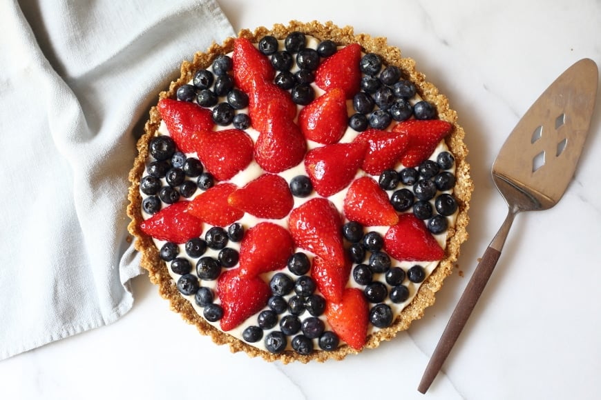 Overhead shot of gluten free berry tart on countertop.