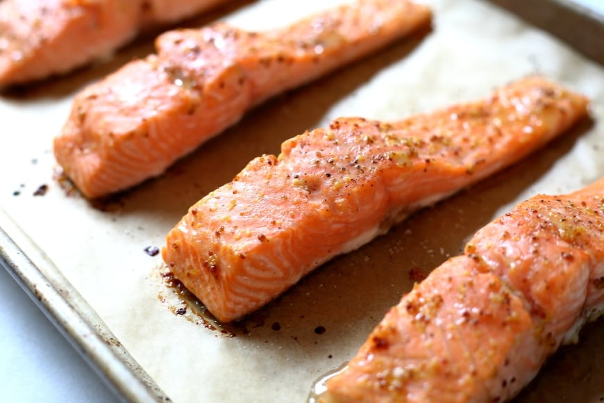 Perfectly cooked roasted salmon is one of the quickest and easiest of weeknight meals, and this maple-glazed version with sweet pea pesto will rock your world.