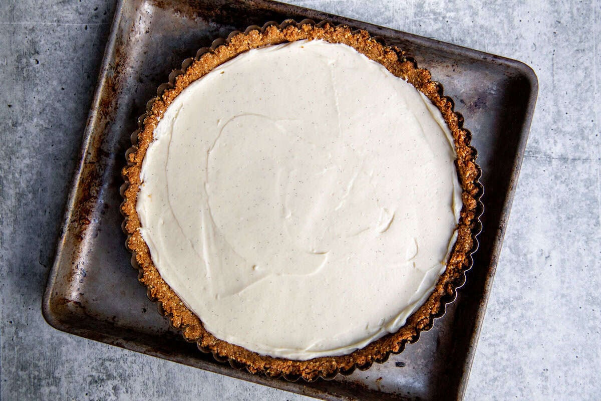 spreading the filling onto the gluten-free crust