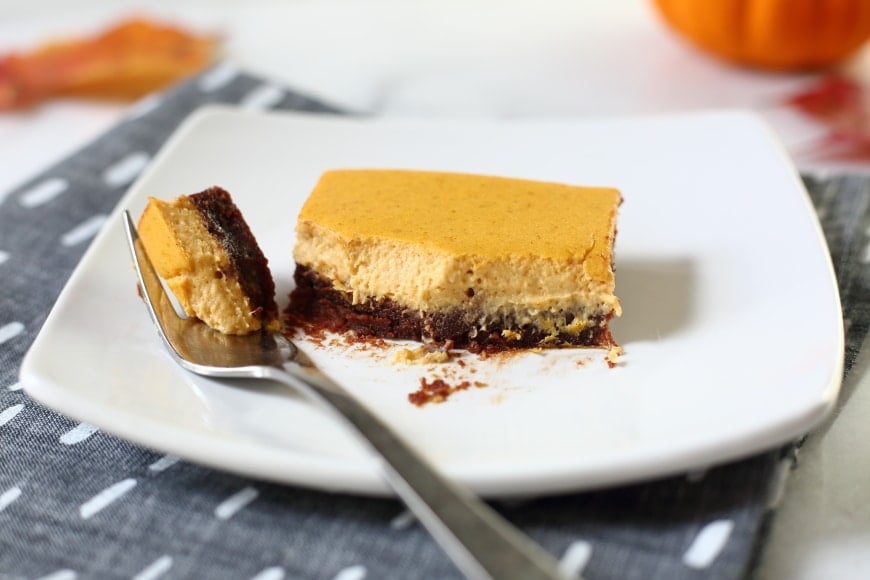 Gluten Free Pumpkin Cheesecake brownies on plate with fork