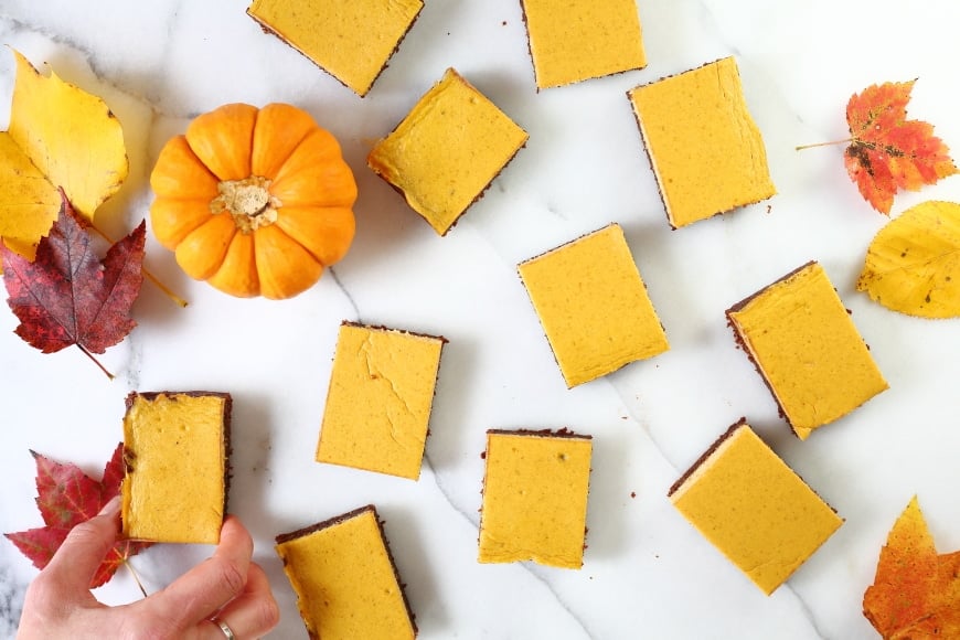 Gluten Free Pumpkin cheesecake brownies on counter.