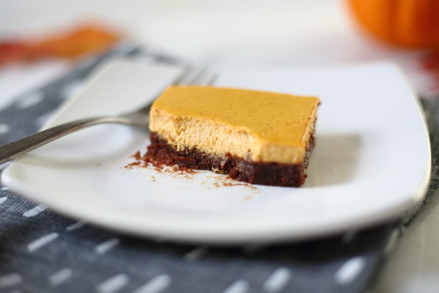 Gluten Free pumpkin Cheese Cake brownies on plate with fork