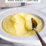 Foolproof homemade mashed potatoes in a bowl with a spoon.