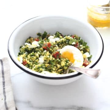 Kale tabbouleh in bowl with runny egg