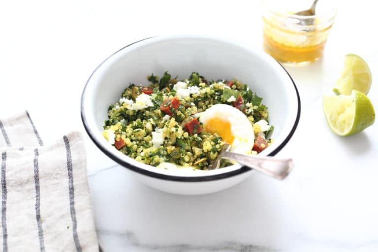 Kale tabbouleh in bowl with runny egg