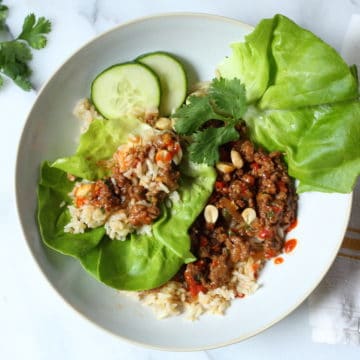Healthy Asian Lettuce Wraps in bowl with toppings