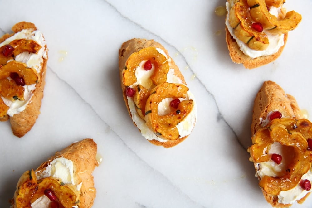 Roasted delicata squash on crostini with goat cheese