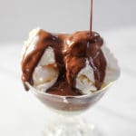 Easy chocolate sauce recipe drizzling over a bowl of vanilla ice cream
