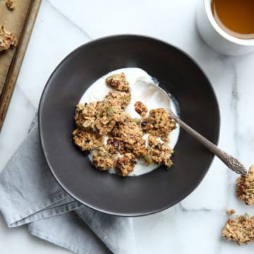 Easy granola clusters recipe, granola clusters in bowl with yogurt