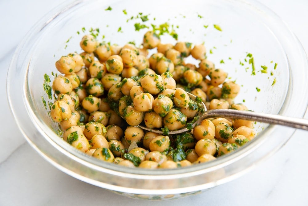 Bowl of marinated chickpeas for the Mediterranean Quinoa Bowls