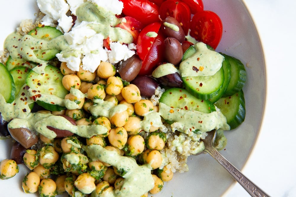 Mediterranean quinoa bowl with green tahini sauce