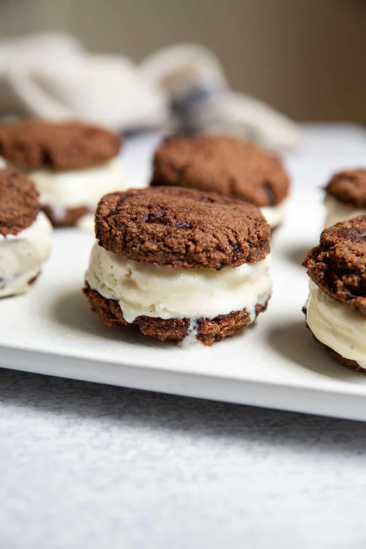 close up of a gluten free ice cream sandwich showing soft cookie texture and creamy interior