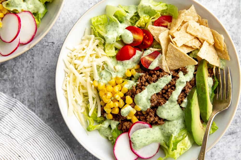 Close-up of healthy taco salad in bowl with fork