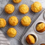 Jalapeno cheddar cornbread muffins on a cooling rack.