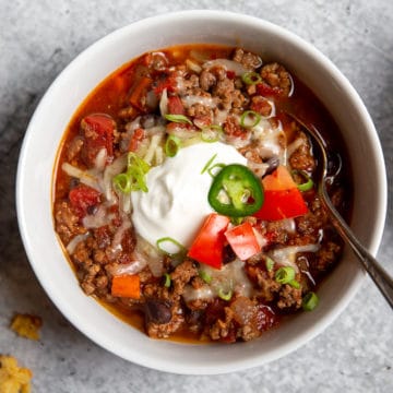 Overhead close-up of a bowl of slow cooker beef chili.
