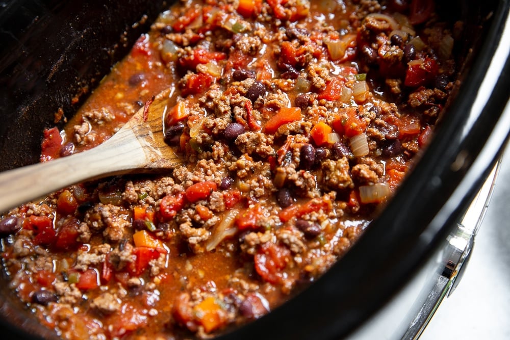 Overhead shot of beef chili in the slow cooker.