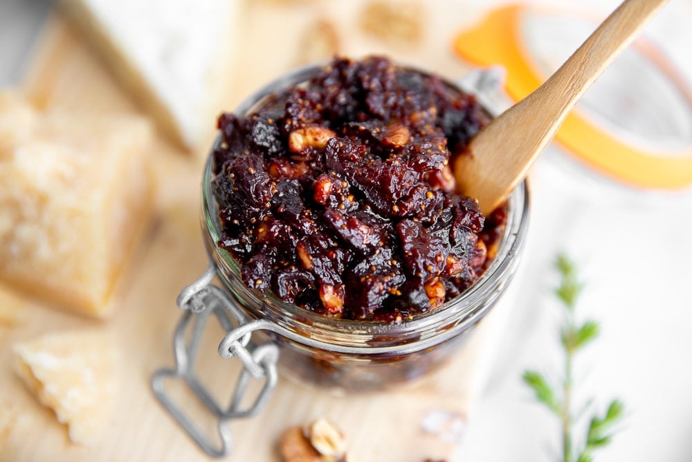 Close up of fig and walnut chutney in a jar. 
