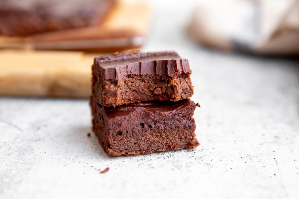 Close up of two stacked brownies. 