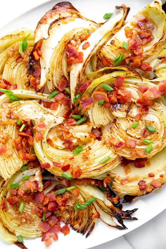 Close up of roasted cabbage wedges with bacon and chives