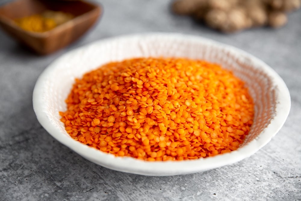Uncooked red lentils in a bowl. 