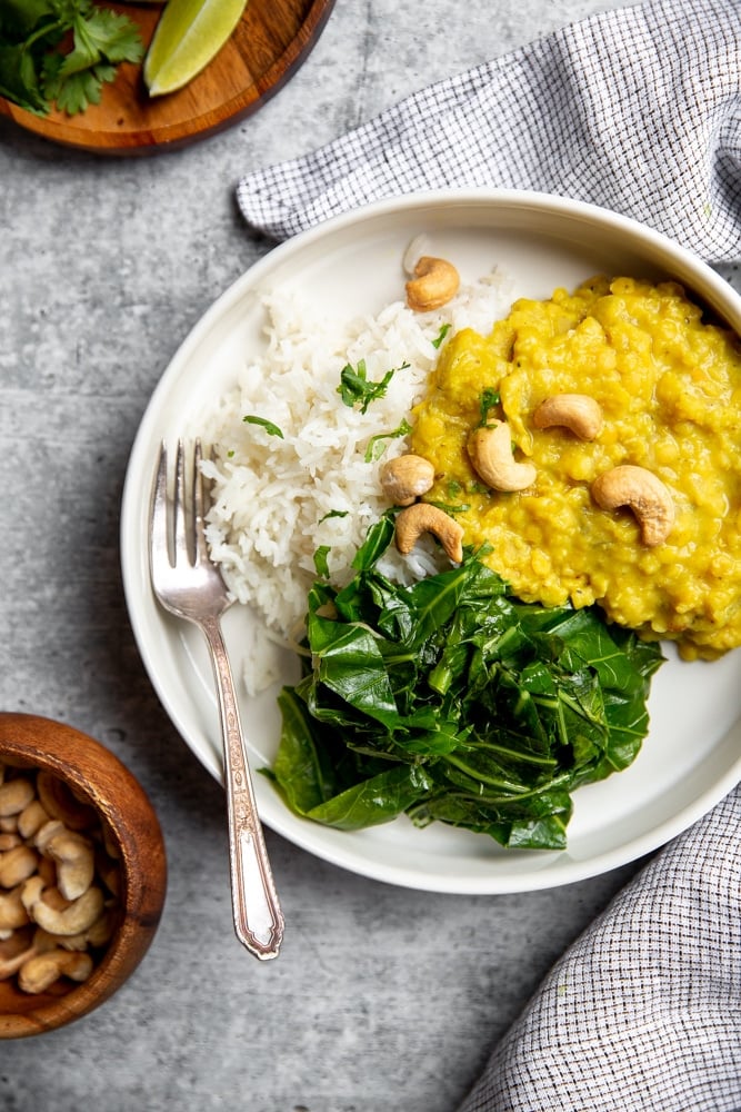 Red lentil dal over rice with sautéed kale and cashews. 