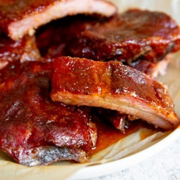 Smoked baby back ribs on a platter.