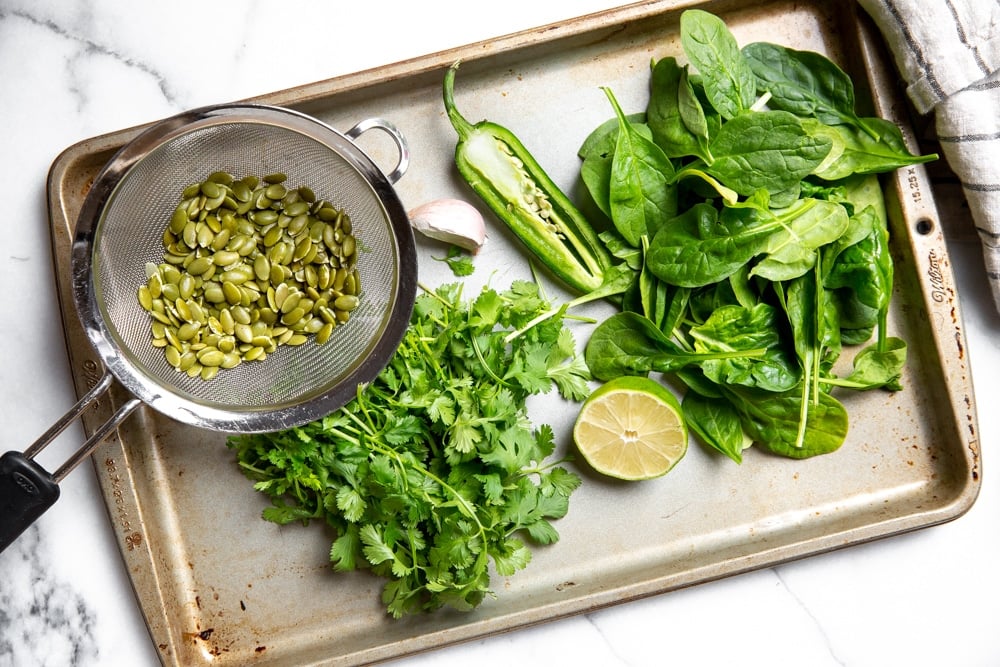 The ingredients for the cilantro lime pesto arranged on a baking sheet. 