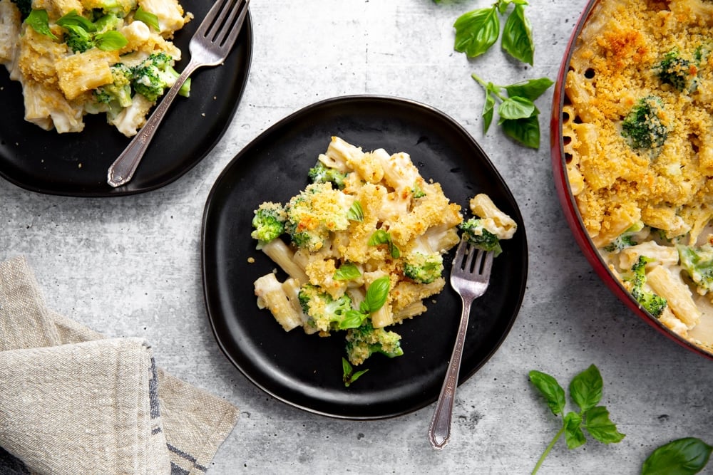 Overhead shot of creamy baked pasta on a plate with a fork.