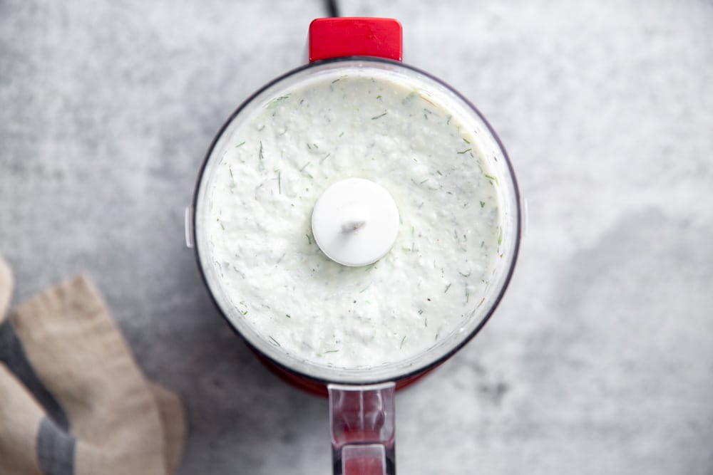 The pureed cottage cheese dip in a mini food processor.