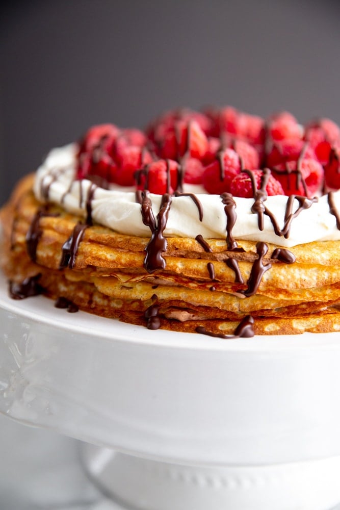 Close up of an easy crepe cake on a cake stand. 