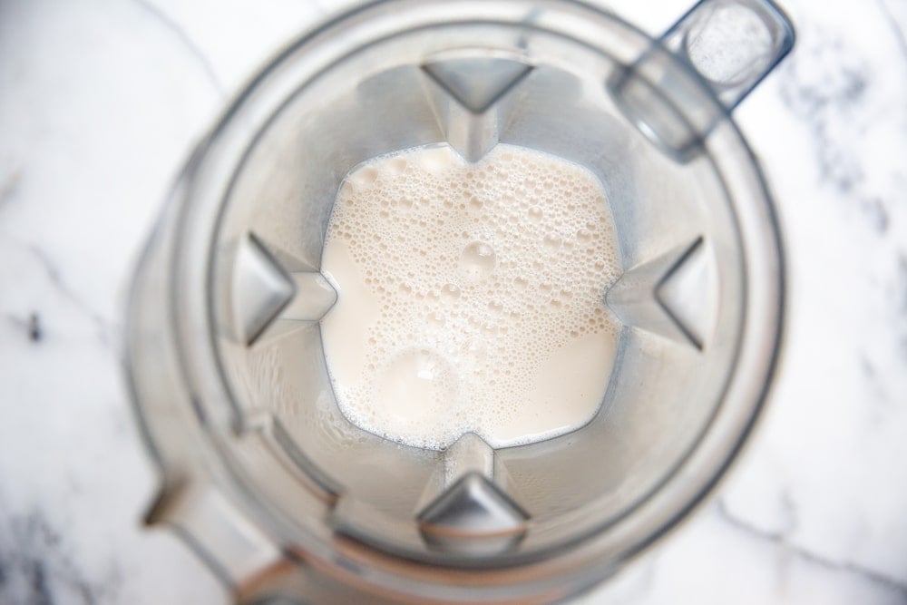 Almond milk in a blender container. 