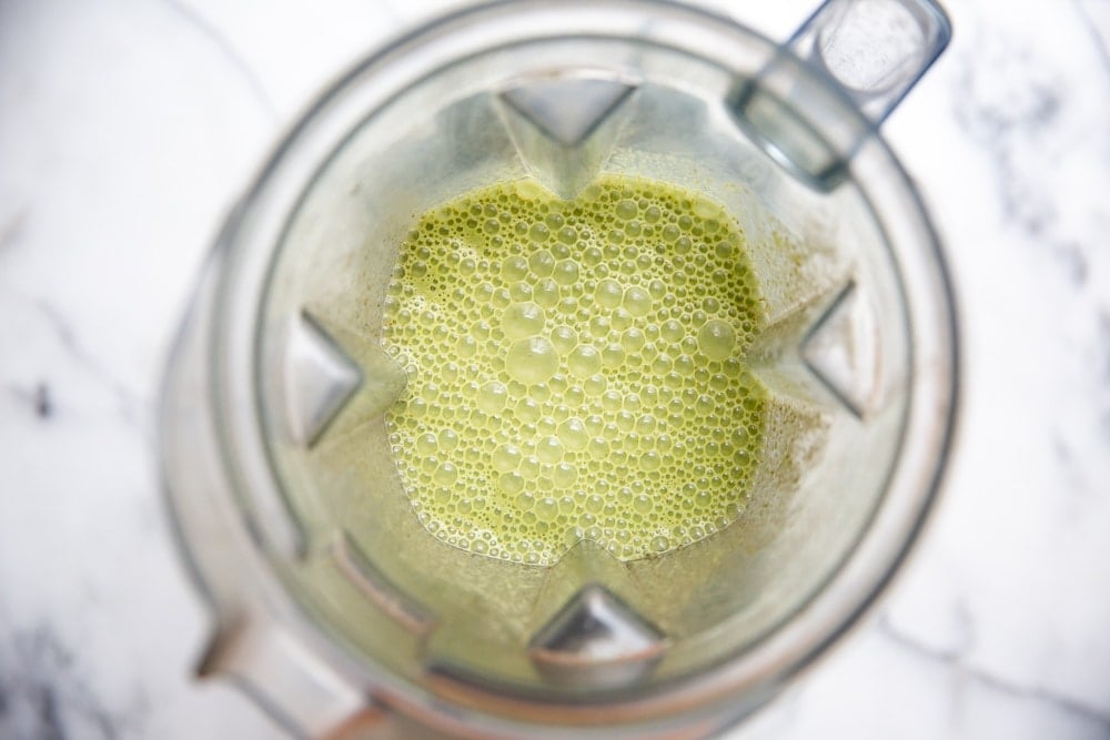 Overhead shot of the low sugar green smoothie in a blender. 