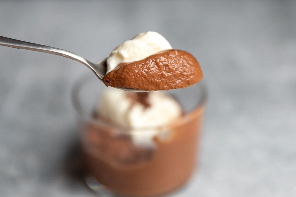 Close up of a spoonful of chocolate pudding.