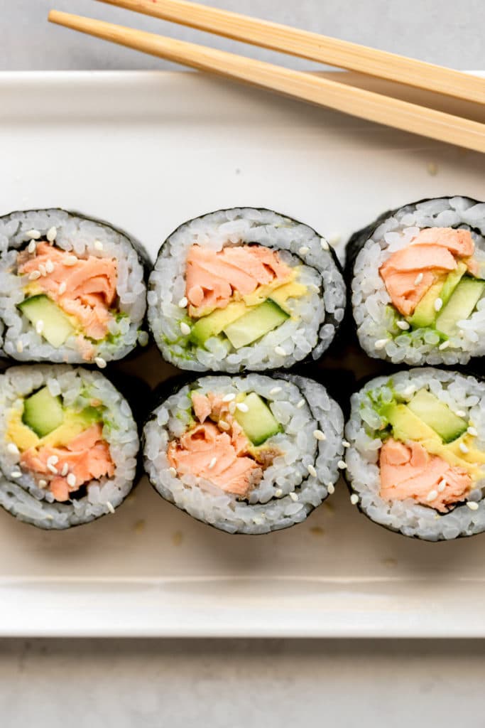 Salmon sushi rolls on a plate. 