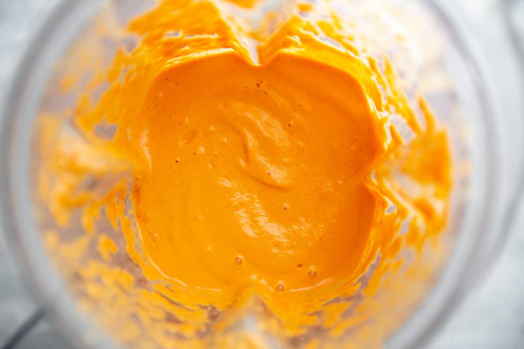 Process shot showing the finished romesco sauce in a blender. 