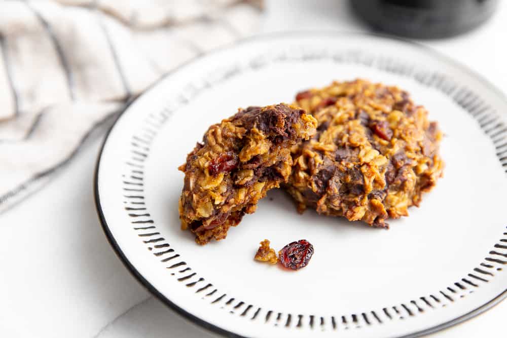 Close-up of two pumpkin oatmeal cookies on a plate. 